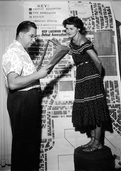 Joe Covas and Frances Veder tally pro- and anti-annexation home owners in western Lakewood in 1953.