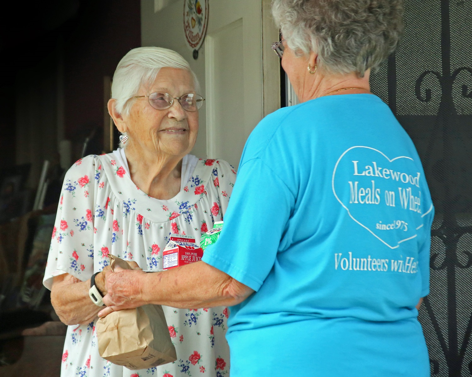 Meals on Wheels volunteer and client