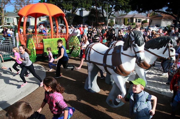 Kids run to try the new Pumpkin playground equipment at San Martin Park in 2014
