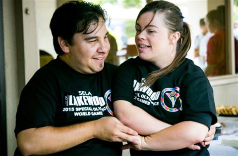 Two smiling people in Adaptive Rec program