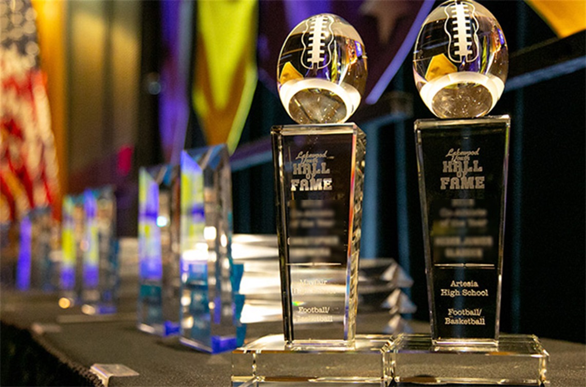 Hall of Fame award trophies displayed on a table