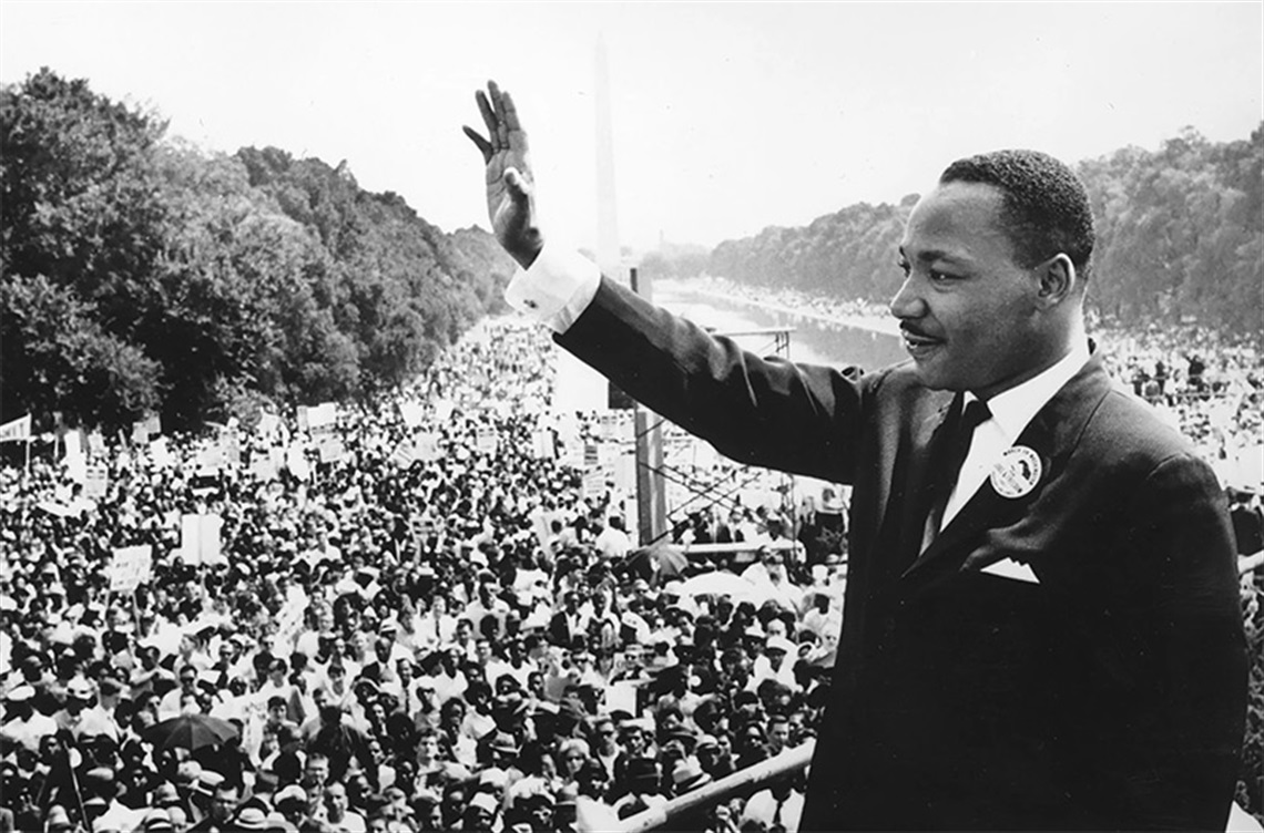 Dr. Martin Luther King Jr waves at crowd in Washington DC
