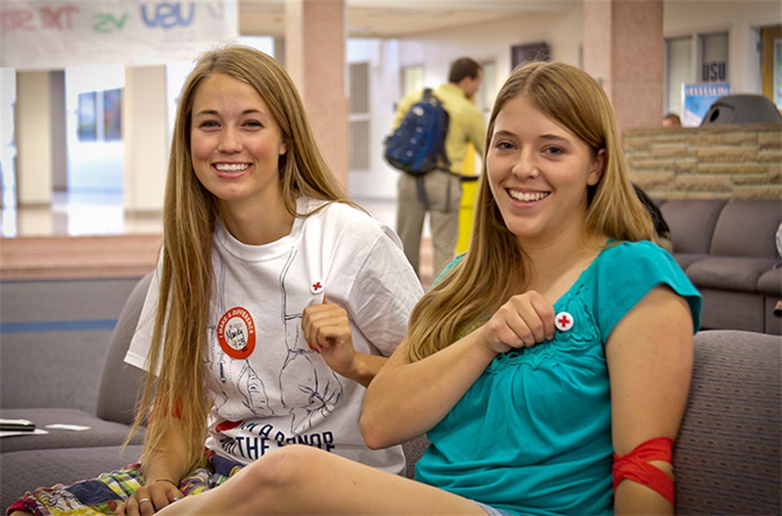 Smiling young women after donating blood