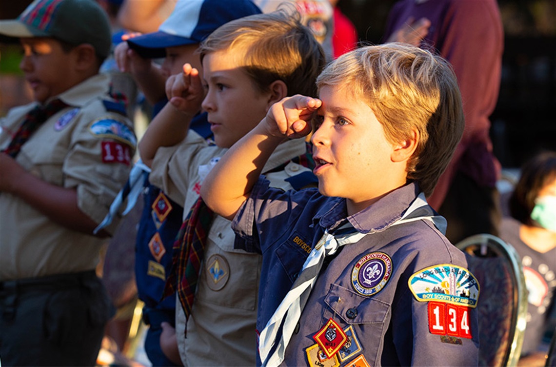 Boy Scout saluting at Patriot Day event