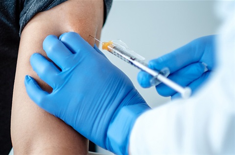 Person receiving a vaccination